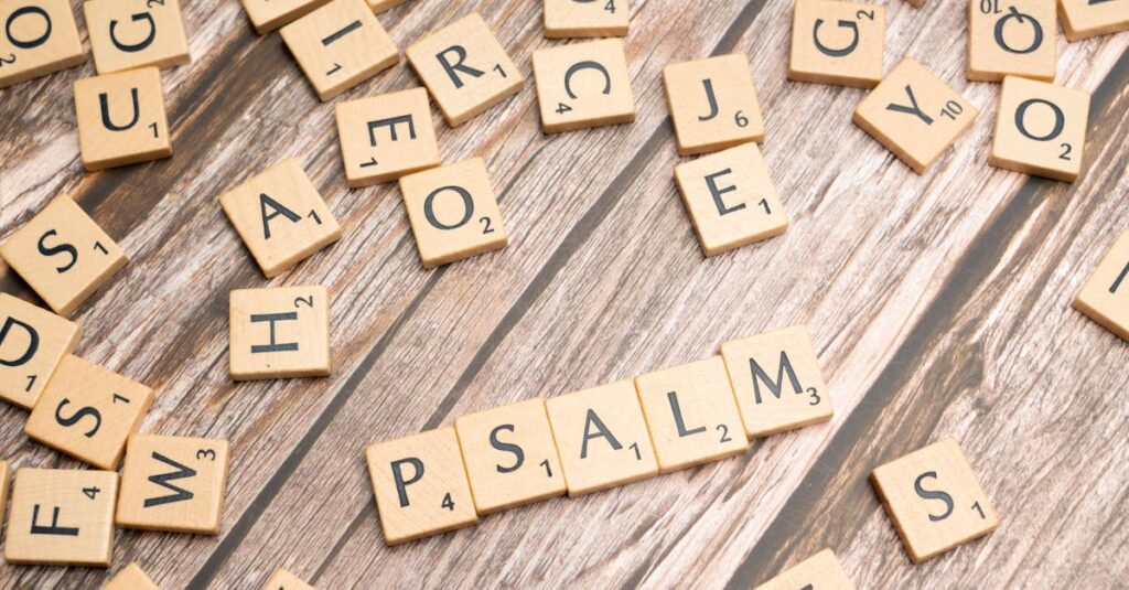 Wooden Scrabble tiles spelling 'Psalm' arranged on a rustic wooden surface, symbolizing creativity and spirituality.