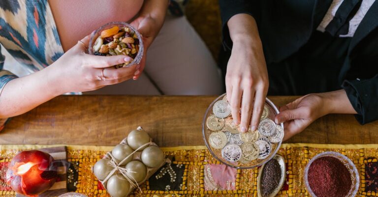 Top view of a decorated Haft-Sin table during Nowruz celebration with nuts and coins.