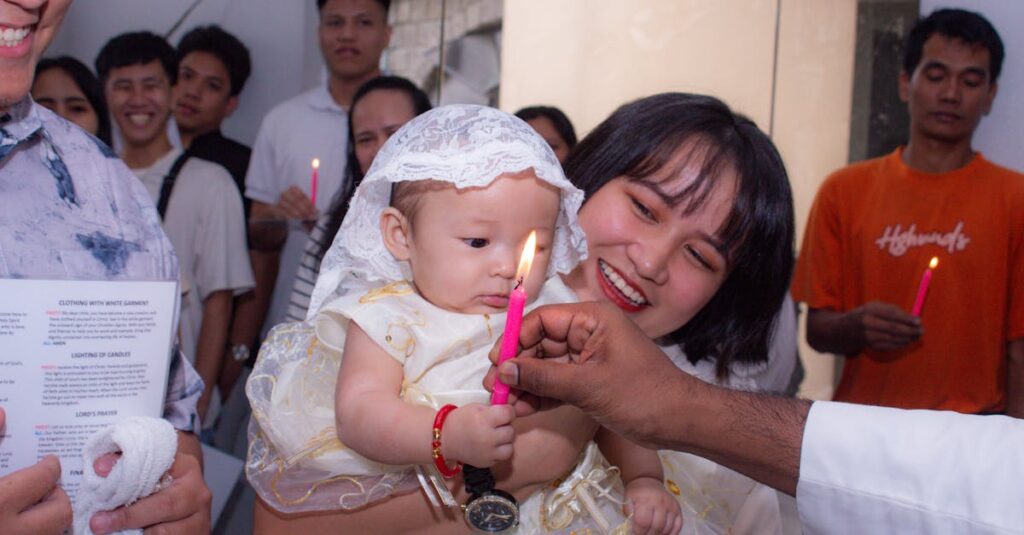 A joyful christening ceremony with family and friends holding candles.