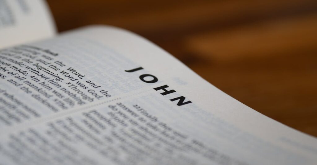 Detailed close-up of the Bible open to the Gospel of John with blurred background.