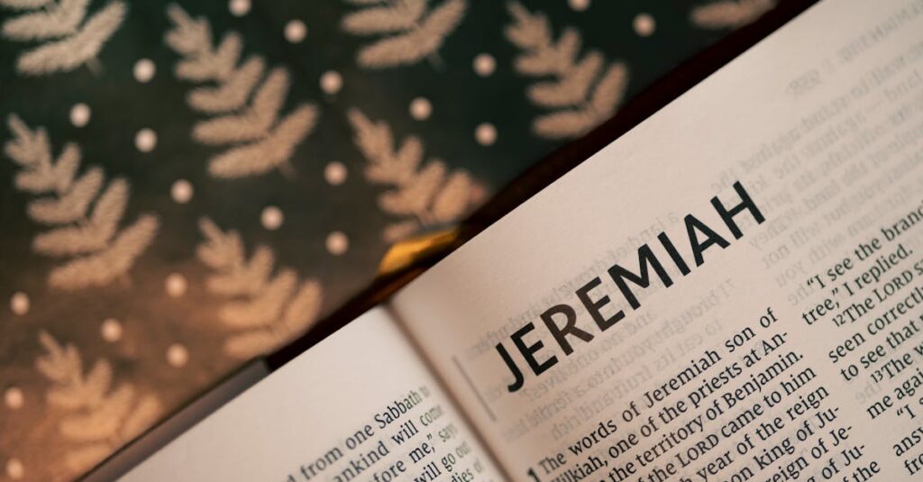 Close-up of the Book of Jeremiah in an open Bible with patterned background.