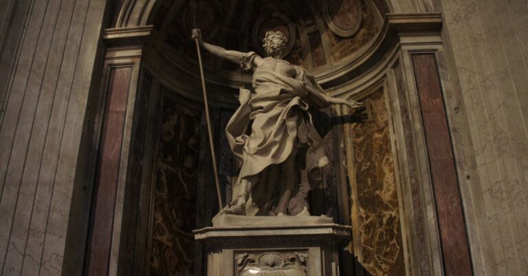 Intricate stone sculpture in a grand indoor setting, showcasing artistic craftsmanship.