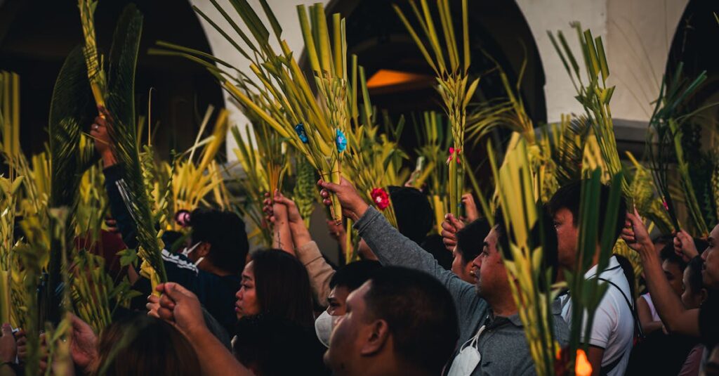 Vibrant Palm Sunday gathering in Baguio City with people holding palm fronds in a cultural celebration.