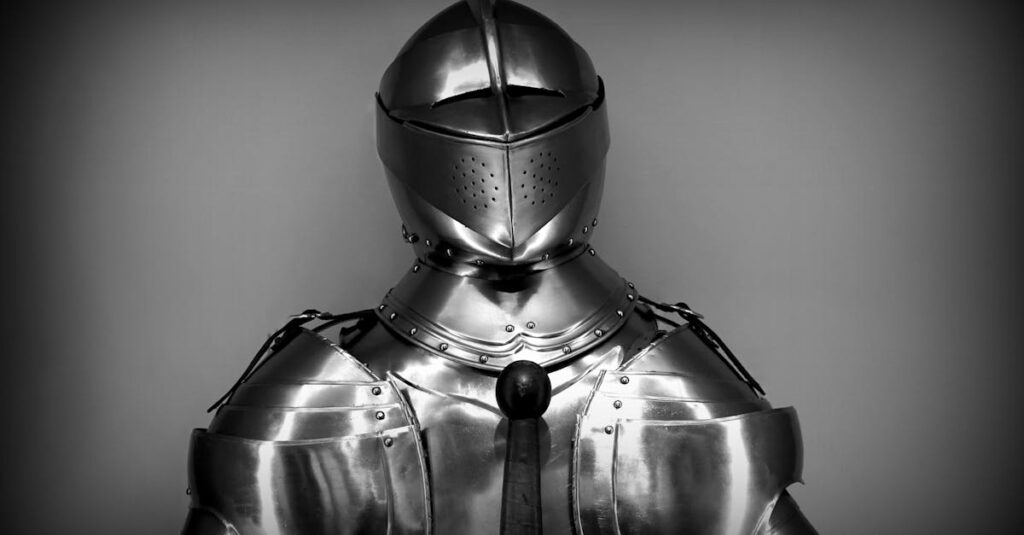 Close-up shot of vintage medieval knight armor in monochrome.