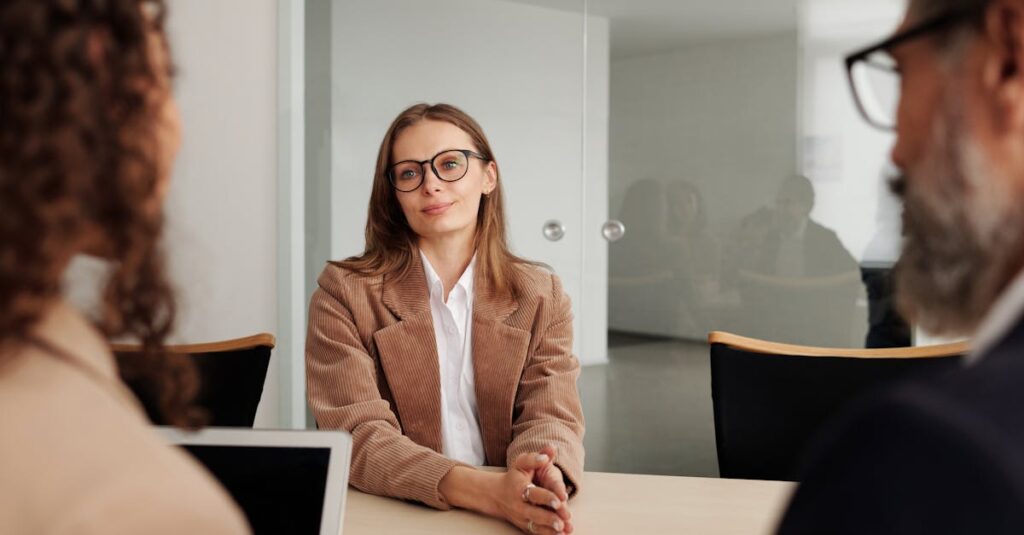 pexels-photo-4342496-4342496 Young woman attending a job interview in a modern office, showcasing confidence and professionalism.