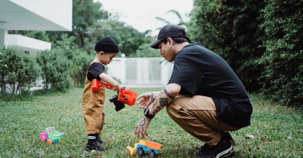 A father and son engage in playful bonding with toy trucks in their backyard.