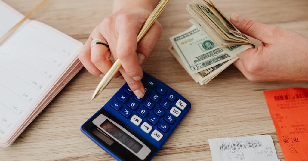 Hands handling cash and calculator for budget planning. Modern financial scene.