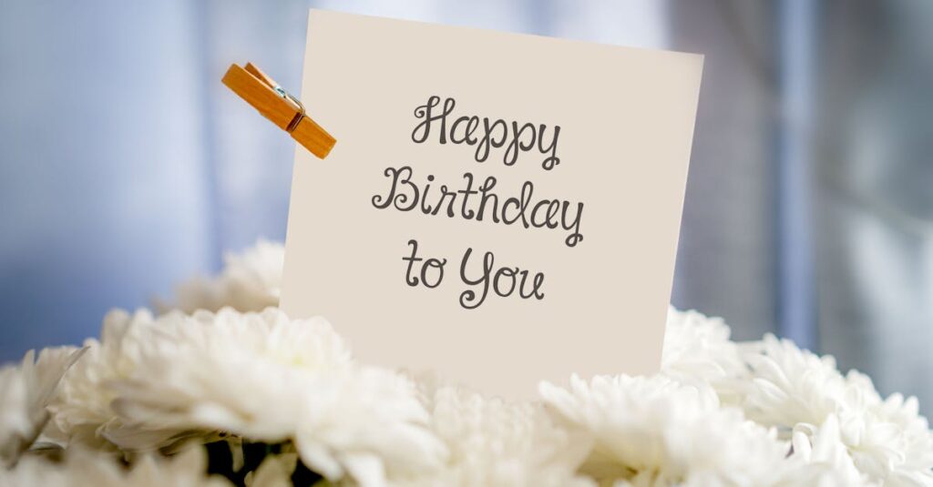 A birthday card with 'Happy Birthday to You' text amidst white flowers for a cheerful celebration.
