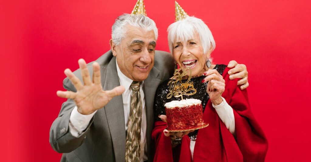 Joyful elderly couple celebrating 60th anniversary with cake and laughter.
