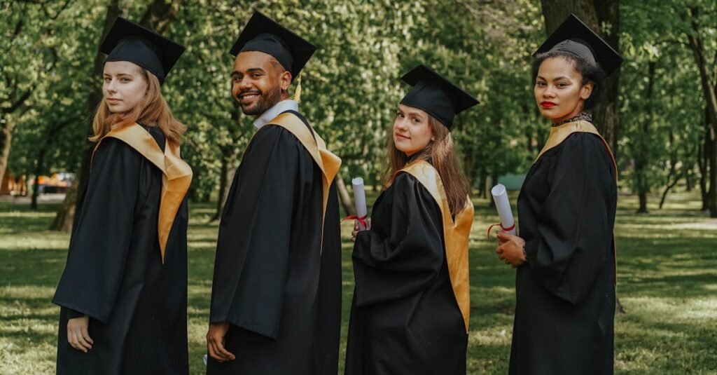 pexels-photo-8093017-8093017 A celebratory group of diverse graduates wearing caps and gowns outdoors, holding diplomas.