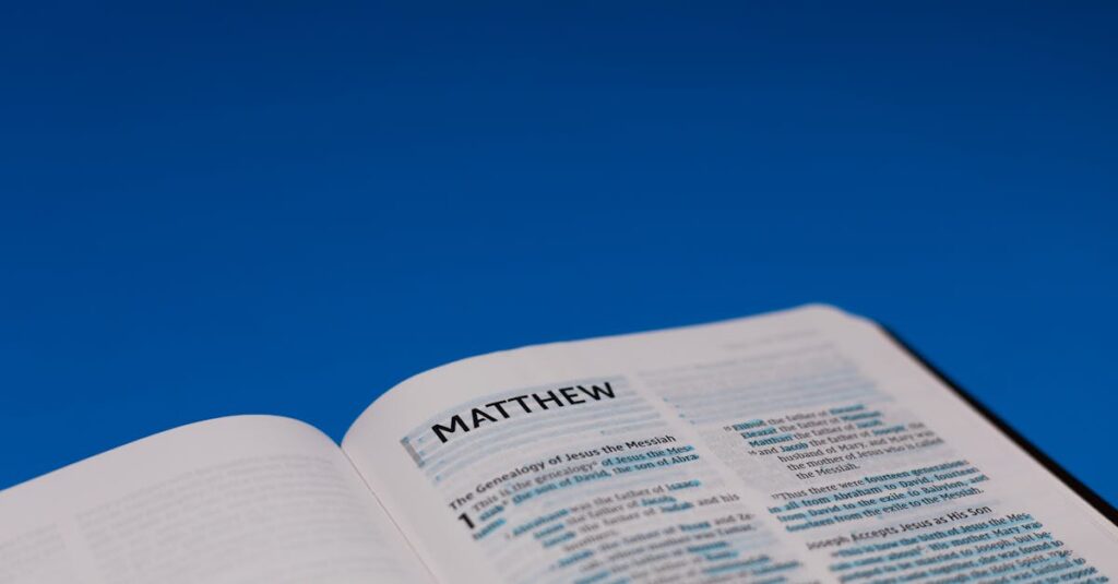 Open Bible displaying the Gospel of Matthew on a vibrant blue background.