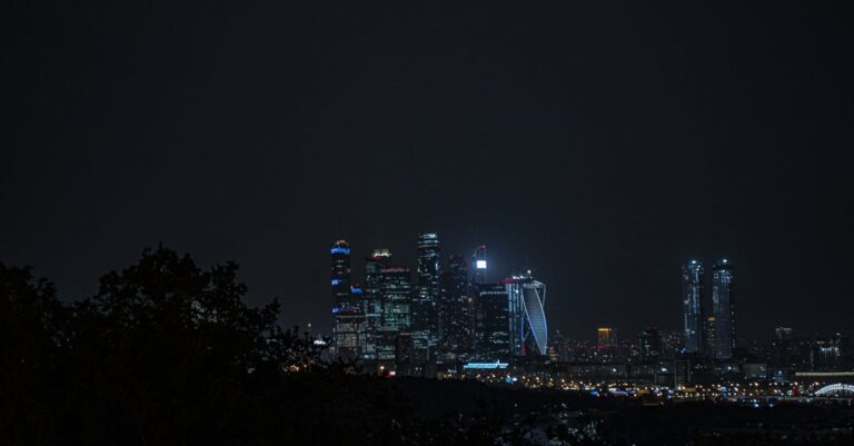 Stunning cityscape featuring illuminated skyscrapers against the night sky.