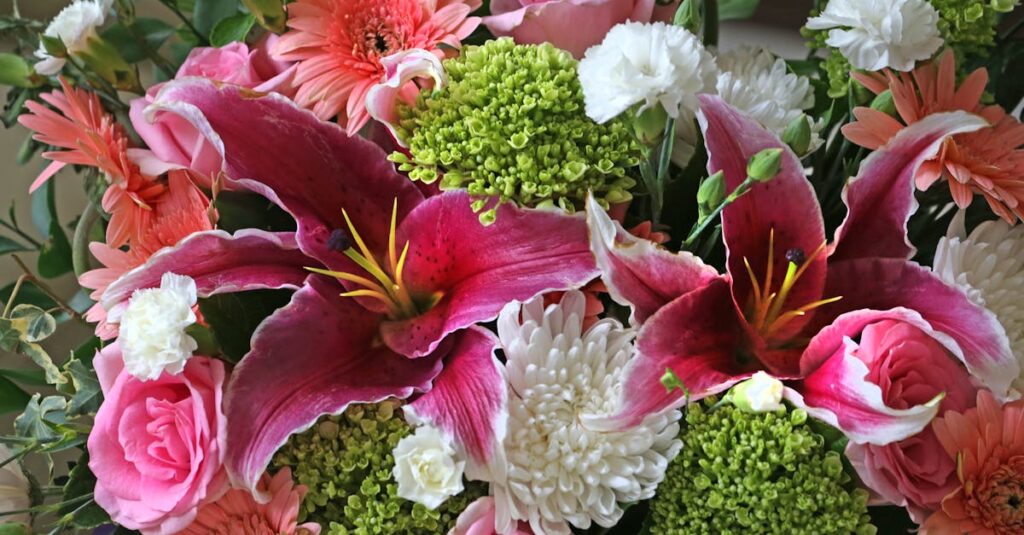 A vibrant bouquet of various blooming flowers showcasing colorful petals and lush greenery.