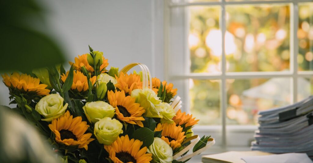 A vibrant sunflower and rose bouquet placed by a sunlit window, creating a warm and inviting atmosphere.