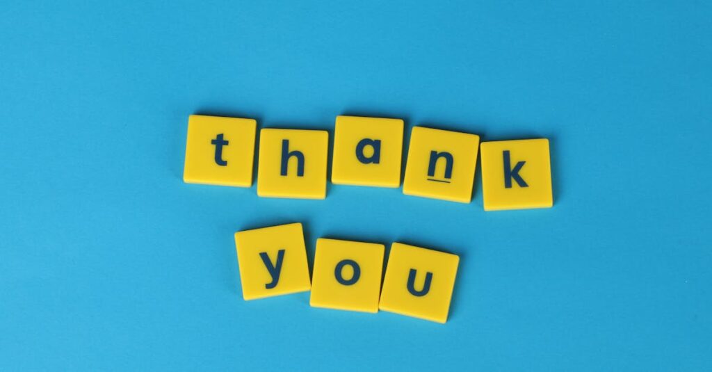 pexels-photo-1887992-1887992 Bright yellow letter tiles spelling 'thank you' on a blue background, perfect for gratitude notes.