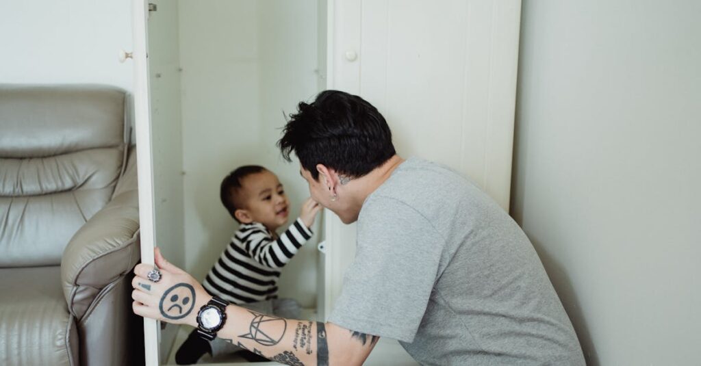 A father and son enjoy a playful moment in a wardrobe, showcasing family bonding.