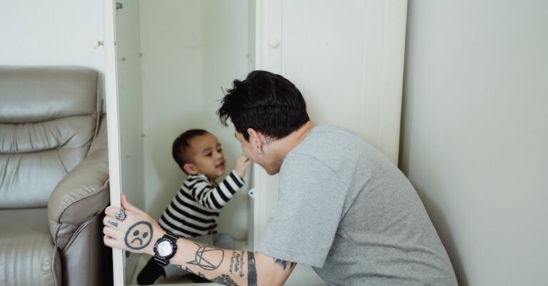 A father and son enjoy a playful moment in a wardrobe, showcasing family bonding.