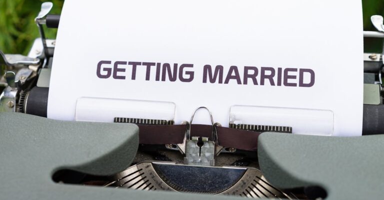 Close-up of a vintage typewriter with 'Getting Married' typed on paper, symbolizing romance.