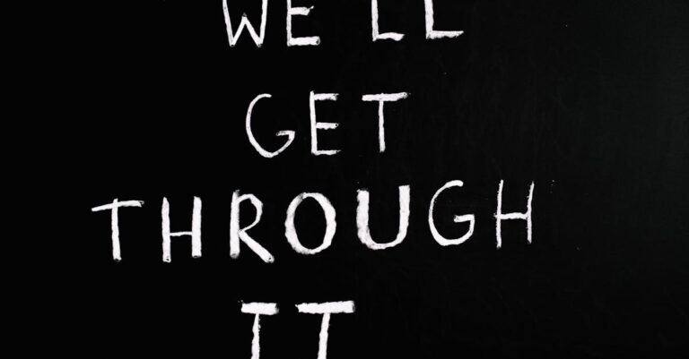 A motivational chalkboard message reading 'We'll get through it' on a black background.