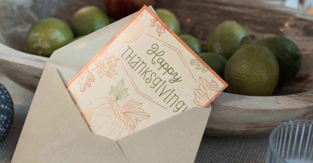 Thanksgiving card displayed with autumn fruits and decor creating a festive table setting.