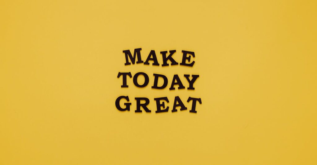 Simple and motivational quote 'Make Today Great' on a minimalist yellow background for inspiration.