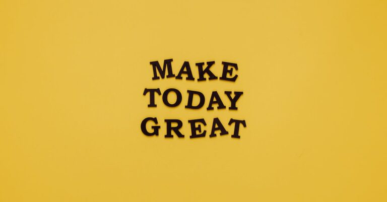 Simple and motivational quote 'Make Today Great' on a minimalist yellow background for inspiration.