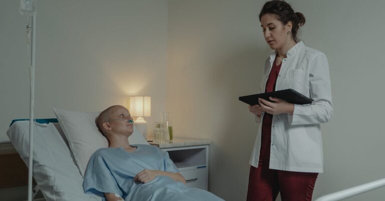 A doctor consults a female patient lying in a hospital bed, offering care and support.