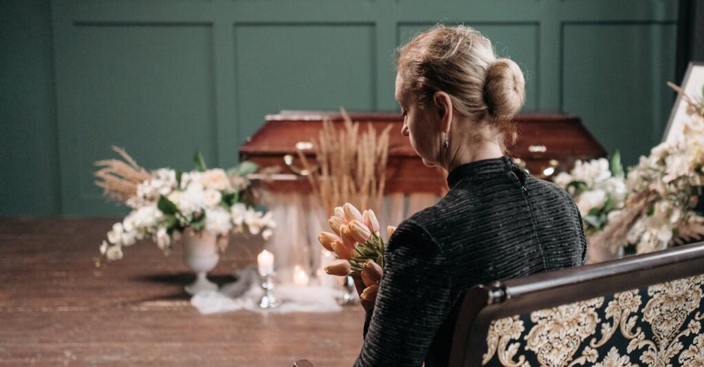 pexels-photo-7317704-7317704-1 A woman in mourning holding flowers at a funeral, highlighting grief and remembrance.