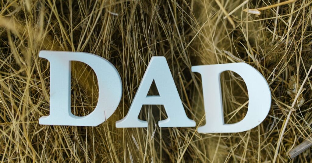 Stylized letters spelling 'DAD' set against a background of rustic hay, perfect for Father's Day themes.