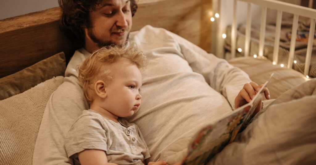 A father and child share a warm moment reading together before bedtime.