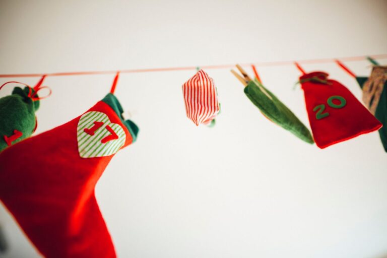 Bright and festive advent calendar stockings hanging indoors for holiday decor.