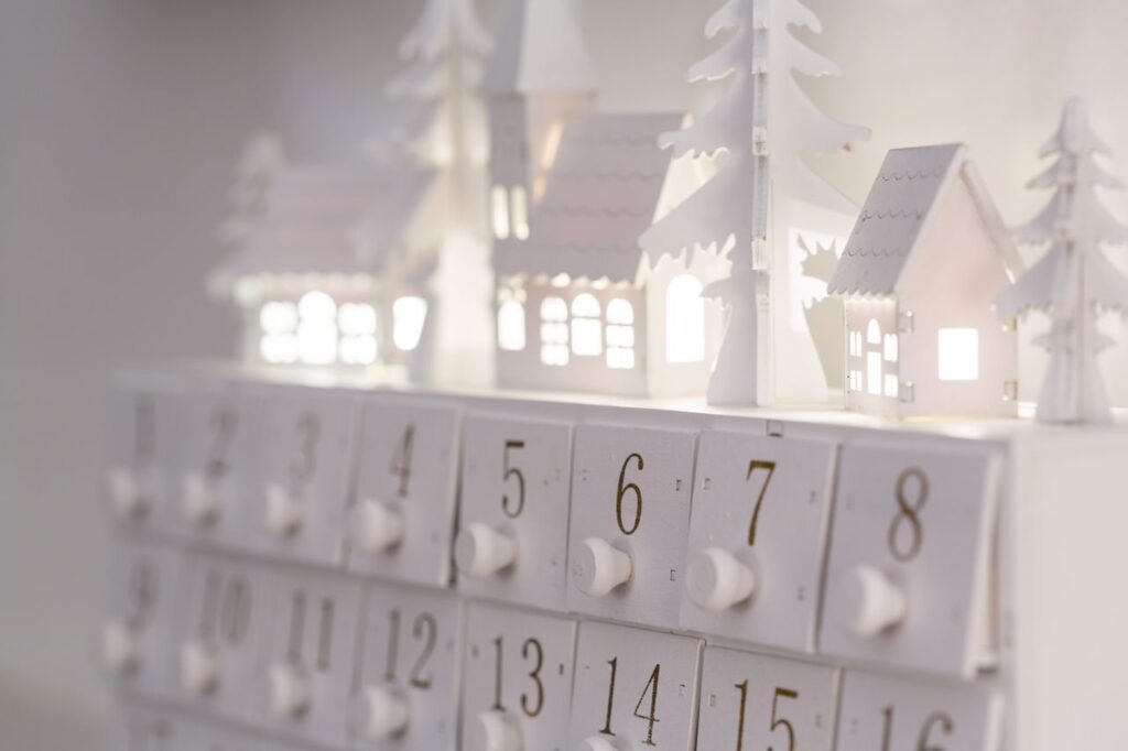 pexels-photo-195030-195030-2 Beautiful minimalist advent calendar with illuminated houses and numbers for winter decor and festive ambiance.
