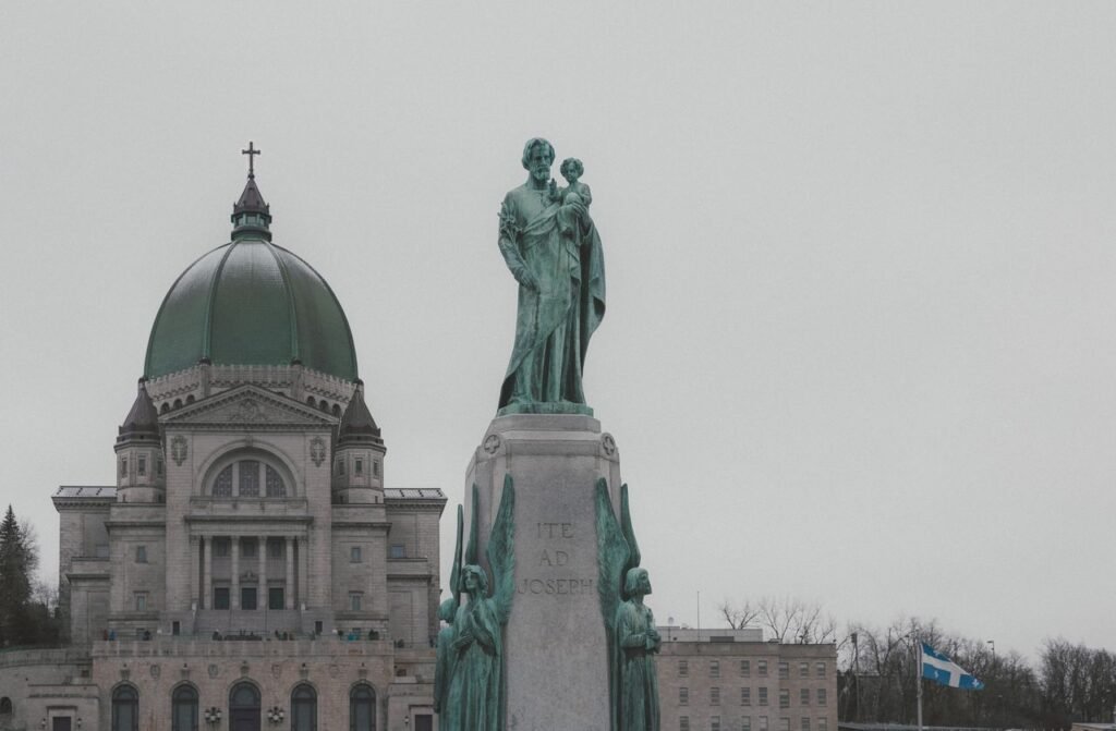 pexels-photo-38349146-38349146 View of Saint Joseph's Oratory and statue in Montreal, Canada, on a cloudy day.