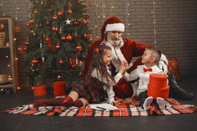 Children sit with Santa Claus beside a decorated Christmas tree, enjoying holiday joy and togetherness.