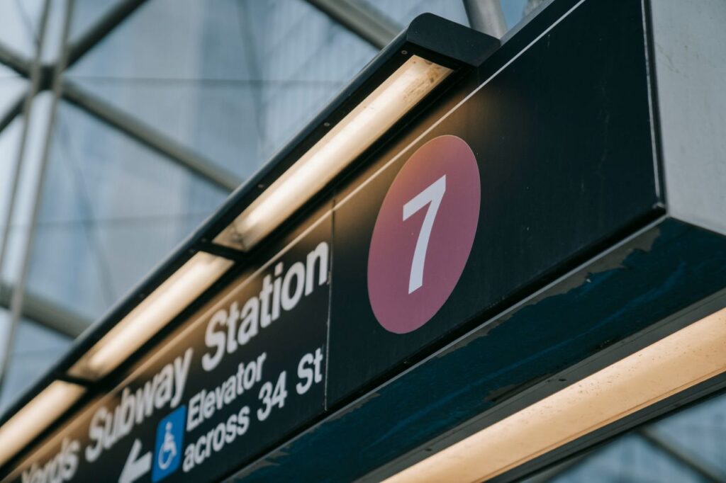 pexels-photo-8554363-8554363 Close-up of a subway station sign with the number seven, located in New York City.